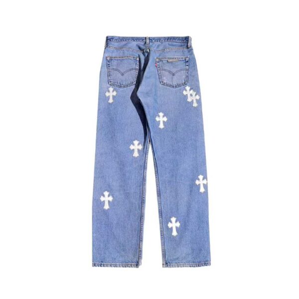 Chrome Hearts blue denim jeans with silver leather cross patches, back view