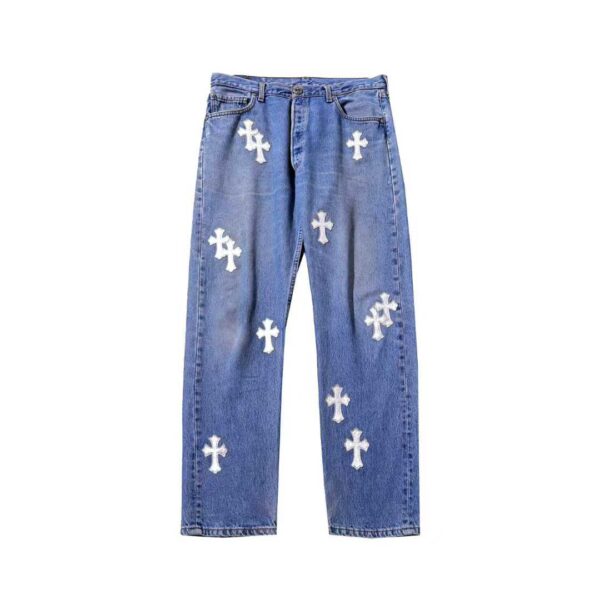 Chrome Hearts blue denim jeans with silver leather cross patches, front view