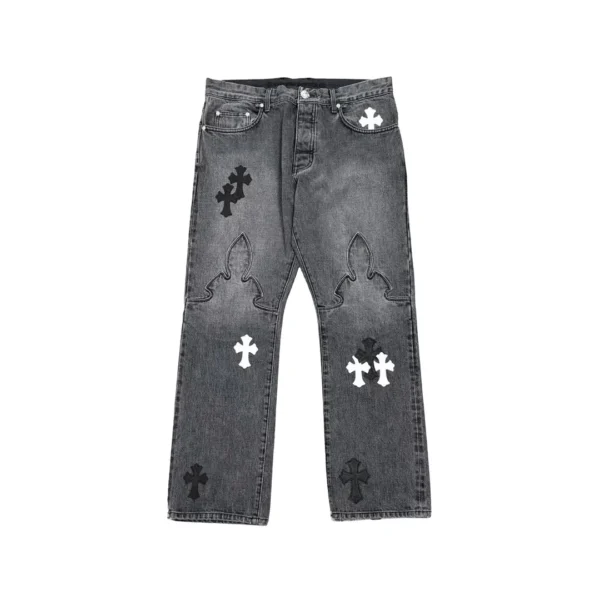 Chrome Hearts grey washed denim jeans with black and white leather cross patches, front view