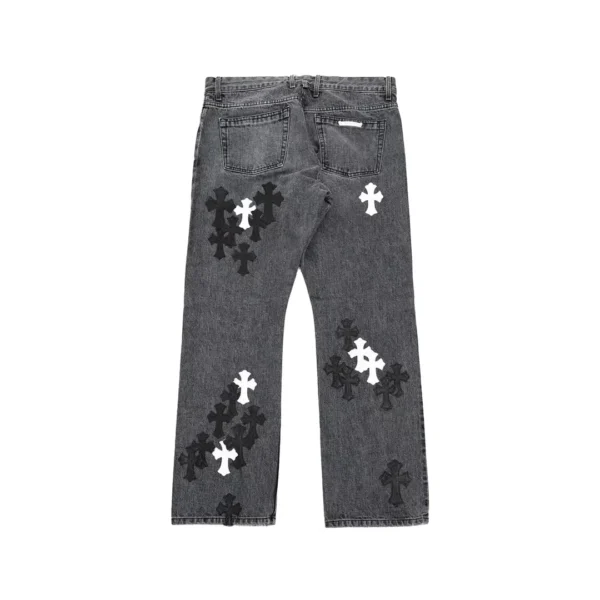 Chrome Hearts grey washed denim jeans with black and white leather cross patches, back view